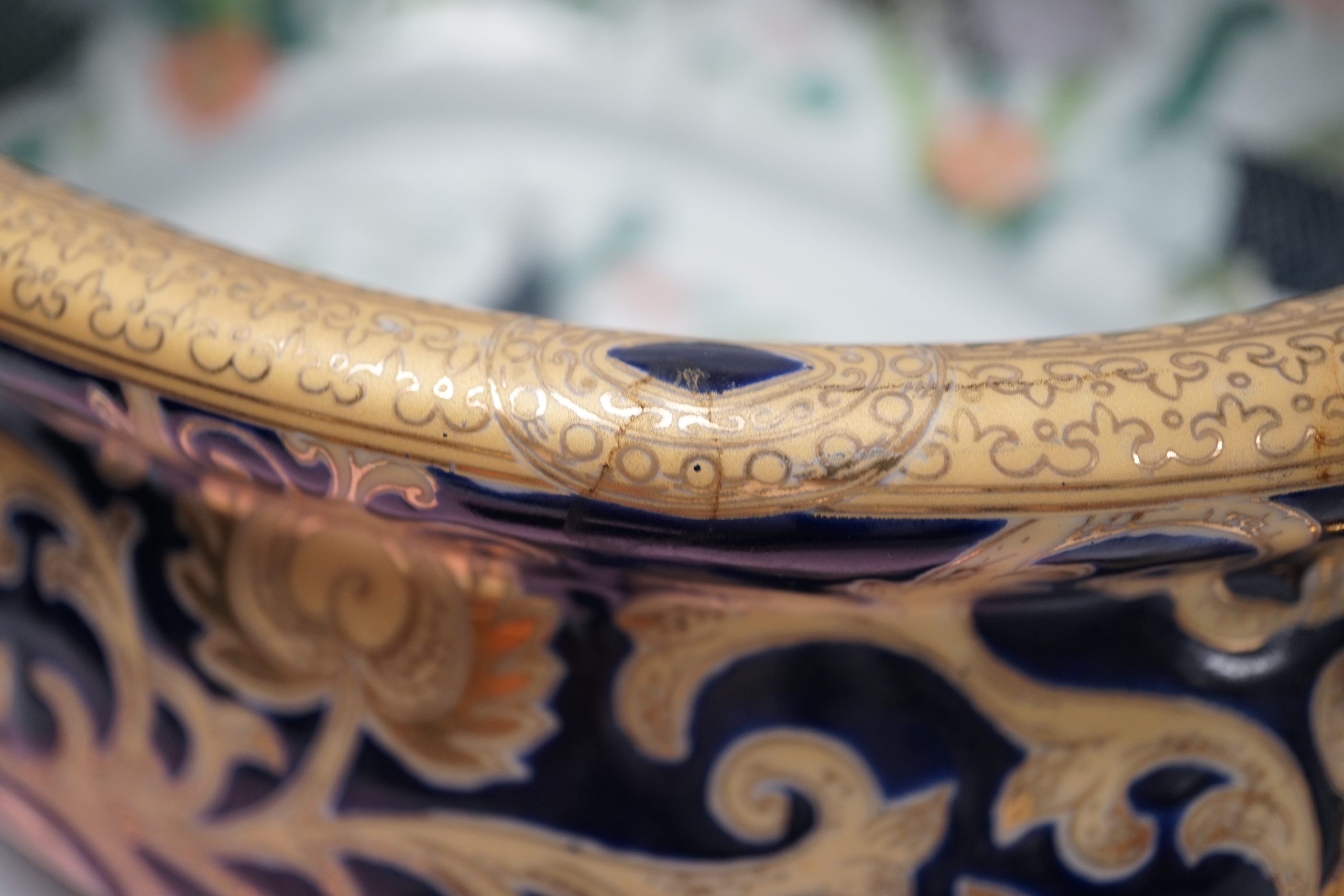 A large Chinese porcelain twin handled bowl decorated with fish and flowers, 44cm wide